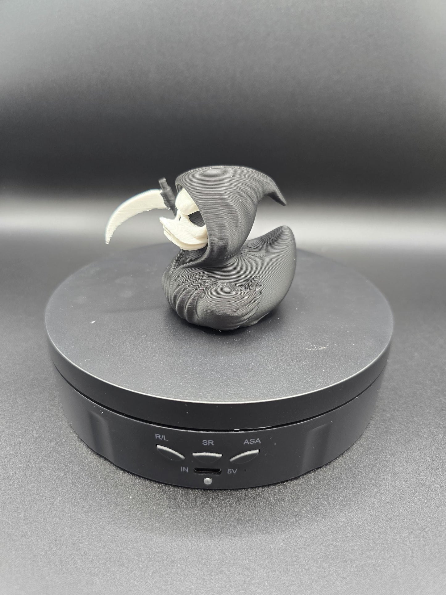 Grim reaper duck figurine