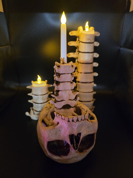 Gothic realistic spine and skull candle holders