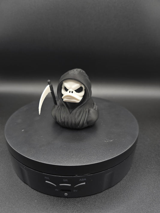 Grim reaper duck figurine