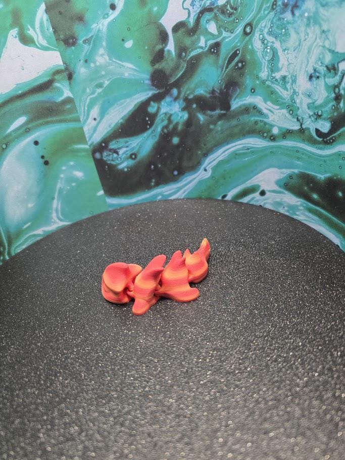 Articulated baby dragon with egg